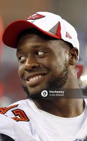 Tampa Bay Buccaneers linebacker Najee Goode (53) is congratulated by  teammates after returning an interception for a touchdown during the first  half at Raymond James Stadium. 64920514 Editorial Image