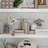 One amazing way to make the most of your bookshelves involves the clever use uniformity is one design component in this space, and books in neutral shades help to create a clean look, along with an array of white decorative. 1