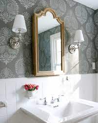 A wall of tiny mosaic tiles is punctuated by a dark wood vanity cabinet in this small bathroom.the cabinet's deep construction allows for plenty of storage despite the necessary undersink plumbing. Decorating A Small Bathroom Ideas Inspiration For Making The Most Of Your Space Driven By Decor
