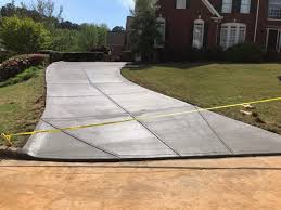 Using a pothole tamper or motorized plate compactor, condense and test the area underneath the hole to ensure its solid. Doraville Concrete Driveway Contractors Sudlow Concrete