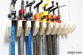 I wanted quick access to all of my clamps (a lot of them) and stuff like glue, screwdrivers, pliers, etc. Diy Pipe Clamp Rack Easy Clamp Rack Using Scrap Wood