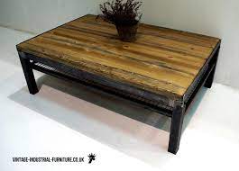 Authentic, original vintage industrial modern coffee table or cart, made from rough sawn pine, steel, metal, and cast iron. Vintage Industrial Coffee Table With Shelf