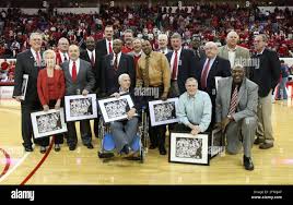 From left, back row, Art Musselman, Howard Pickett, David Thompson, Tommy  Burleson, Mike Buurman, Mark Moeller, Greg Hawkins, Jerry Hunt, Tim  Stoddard, Biff Nichols. Front Row: Joan Sloan, Monte Towe, Dwight Johnson,
