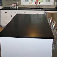 Sticking with dark granite, black galaxy granite is another incredible countertop material to pair with your light kitchen cabinets. Solid Black Quartz Countertop