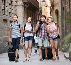 #25 in best places to visit in europe. Group Of European Tourists Walking The Street With Luggage At Vacation Stock Photo Picture And Royalty Free Image Image 53496644