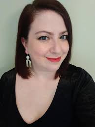 Girl wearing mini gold hoop earrings