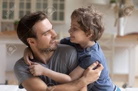 Any act or expression of affection; Loving Dad Caressing Touching Child Sitting On Sofa At Home Stock Photo Picture And Royalty Free Image Image 135467376