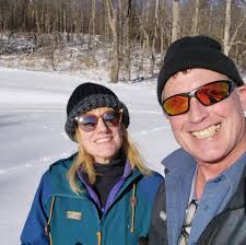 What are some considerations and recommendations for acquiring a small  holding in New England, specifically for off-grid living and supplemental  solar and wood use?