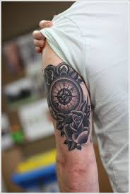 Covering the arm fully and lot of region shaded, this tattoo offers interesting adornment for the men's arms. 99 Amazing Compass Tattoo Designs Tricep Tattoos Compass Rose Tattoo Compass Tattoo Design