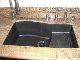 A kitchen sink has to cope with a lot through its lifetime, with everything from scalding hot water and oil, to dishes and cutlery being dropped in it on a regular basis. Swanstone Sink Composite Kitchen Sinks Granite Kitchen Granite Kitchen Sinks