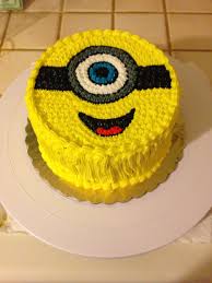 What better way to design a minion themed cake than creating a minion shaped cake? Minion Frosting Cake Minion Birthday Cake Cartoon Cake Themed Cakes