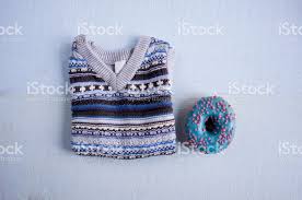 Maybe you would like to learn more about one of these? Blue Knitted Waistcoat For A Baby With A Blue Glazed Donut Stock Photo Download Image Now Istock