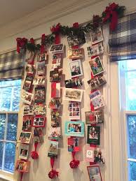 Tie a matching bow at the top and loop a length of it through the back to hang. Different And Unique Ways To Display Christmas Cards