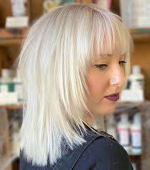 Frame your full face with a choppy layered haircut. Shag With Graded Face Framing Layers Framed Face Haircut Face Framing Hair Face Framing Bangs