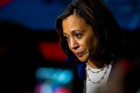 Women are wearing pearls and Chuck Taylors for Kamala Harris