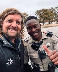 I got a flat tire in Hill Country part of Texas. The rental car has a spare  but no jack to put it on. This officer saw me, stopped and called his