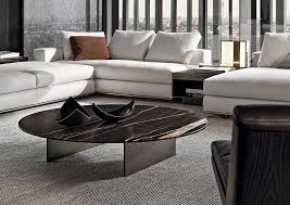 The base is crafted from solid acacia wood, and has three sled legs that meet in the center for a bold, structural look. Linha Coffee Tables En
