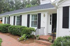 White house + black shutters. Painted Brick Houses Before And After The Long And Short Of It Painted Brick House White Brick Houses Brick Exterior House