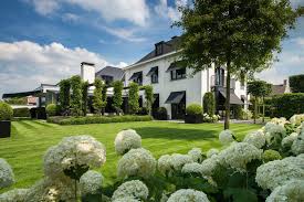 Two floors villa exterior design with biophilic elements, entrance pathway and landscape. Sleek Contemporary Garden Design Blends Classic And Modern