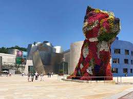 Maybe you would like to learn more about one of these? At The Guggenheim Museum Bilbao Jeff Koons Puppy Gets A Colorful New Coat The Guggenheim Museums And Foundation