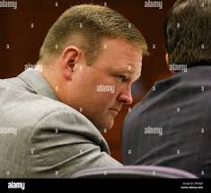 Former Pleasure Ridge Park High School football coach David Jason Stinson  listens to testimony during his