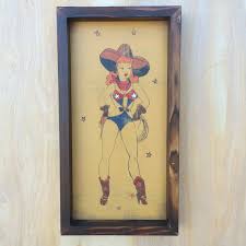 This pin up tattoo design is one of many that depict seductively posed women performing what was believed to be a lady luck tattoo designs: Cowgirl Pin Up Taboo Island