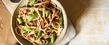 White Bean Fettuccine Alfredo With Peas And Sun Dried Tomatoes Recipe Fettuccine Alfredo Vegan Recipes Healthy Fettuccine