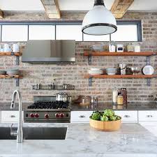 Replacing cabinets with open shelves is an easy and trending alternative for a kitchen with no upper cabinets. Kitchens Without Upper Cabinets Design Ideas