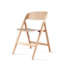 The Folding Chair Gets A Modern Update Folding Chair Wooden Folding Chairs Wood Folding Chair