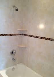 8x12 Ceramic Shower Wall Tile Installation With A 1x1 Glass Accent Band In Largo Florida Tile Shower Shower Tile Bathtub Tile Surround Bathroom Tub Fixtures