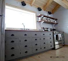 The main reason was i wanted custom sizes to fit around the windows, and we wanted an open shelf on the end for a cooler. Diy Apothecary Style Kitchen Cabinets Ana White