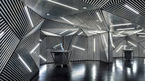 Architects Ministry Of Design Created This Faceted Robotics Lab In Singapore To Train An Metal Shop Building Black Interior Design Interior Design Presentation