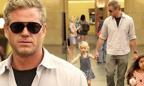 Sunglasses-clad Eric Dane takes his little princess to a Disney party