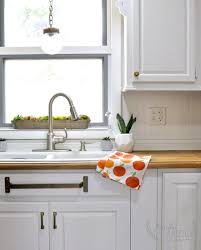 brass towel bar under the sink