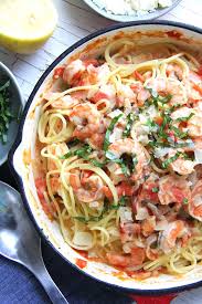 A creamy garlic prawn pasta with a garlic infused silky creamy sauce and plump prawns. Creamy Tomato Basil Shrimp Pasta Recipe Recipes Pasta Dishes Cooking Recipes