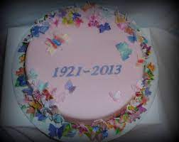 The anniversary of a death can be a time for quiet and simple contemplation, or for family gatherings, fellowship and remembrance. Round Cake To Celebrate A Life At The Funeral Covered In 92 Butterflies To Signify Each Year Of Her Life Funeral Cake Cupcake Cakes Cake Inspiration