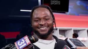 Javonte Williams had a great reaction to being pushed into end zone by  teammates