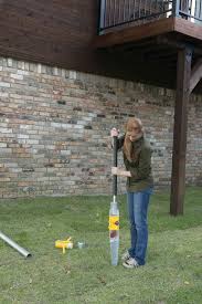 All you need to do is drill a hole into the mortar and put in a wall anchor. Oz Post Steel Post Anchor Being Driven In Using The Mdk 10 Manual Post Driver Steel Fence Posts Steel Fence Fence Post