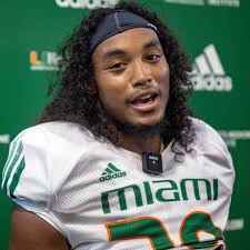 Miami DE Patchan surprises two-time UM national champion dad