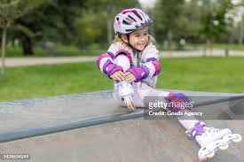 Teenage Girl Sitting On Skateboard Portrait High-Res Stock Photo
