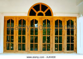 It offers an elliptical handrail above and utilizes 21.5mm of toughened clear glass. The Glass Windows Of A Modern House With A Wooden Framework Stock Photo Alamy