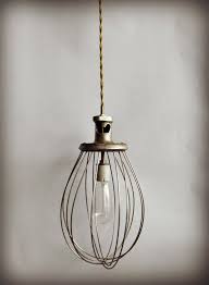 This light is designed of metal chain link strands in a distressed white finish with metal scallop edge detail. Vintage Pendant Lamp Whisk