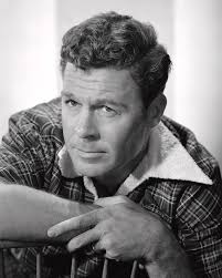 John Archer Looking Away While Leaning On Chair Photograph by Globe Photos 