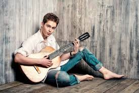 Romantic Guitar Romantic Young Man Playing An Acoustic Guitar Sitting On The Wooden Floor Pose Reference Human Poses Reference Sitting Pose Reference But just before we get started. romantic guitar romantic young man