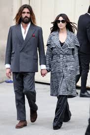 How does monica bellucci spend her summer seasons? Monica Bellucci Attends Chanel With Her Boyfriend Nicolas Lefebvre Vogue