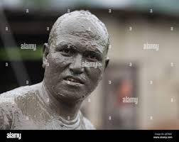 Mud covered farmer hi-res stock photography and images