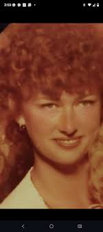 Melungeon woman with greenish blue eyes and auburn hair