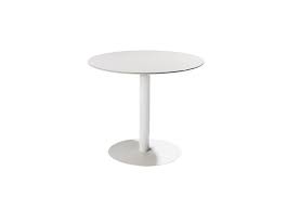 A slim tripod base of raw brass supports a rounded tabletop of polished white marble. T Table Dining Table Tribu