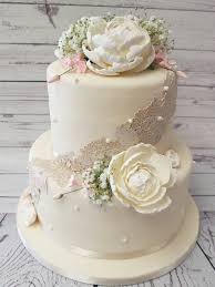 Yellow edible pearls, scroll piping, white roses and irises. Crafty Cakes Exeter Uk Vintage Wedding Cake With Edible Lace Sugar Peonies