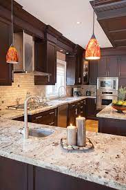 Giallo ornamental granite with maple cabinets. Giallo Ornamental Granite For Warm Elegant Kitchen Design
